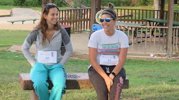 Two 5K runners sitting together